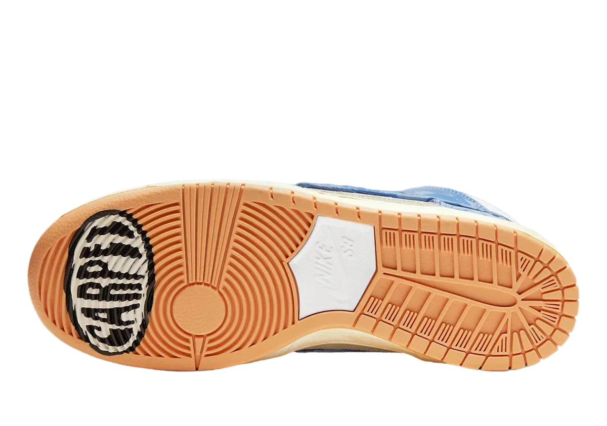 Close-up of a shoe sole with a brand logo on a blue background