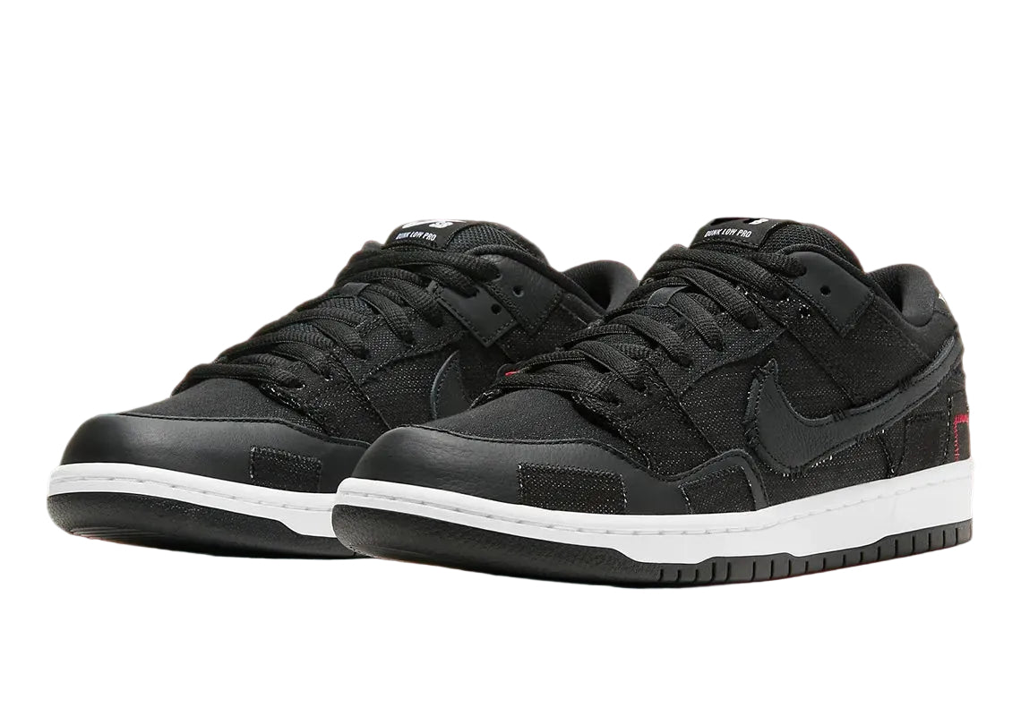 Black sneakers with white soles on a red background