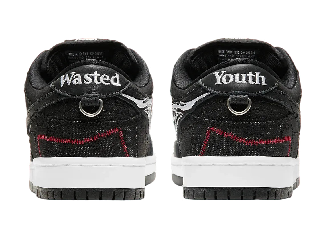 Black sneakers with 'Wasted Youth' branding on a red background